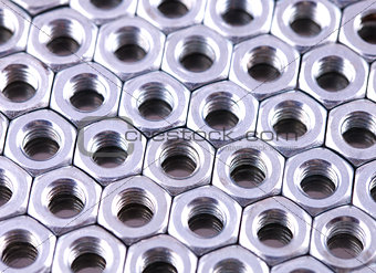 Nuts of bolts as a background