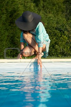 touching water on swimming pool