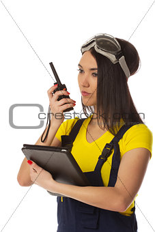 Woman with cb radio and tablet computer, portrait.