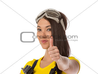 A female construction worker holding an up signal - isolated.