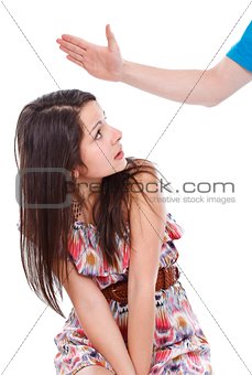 Hand hitting teenage girl