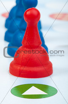 Red and blue game pawns white isolated