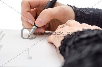 Closeup of a businesswoman signing a contract