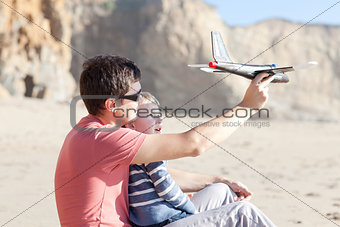 playing with a toy plane