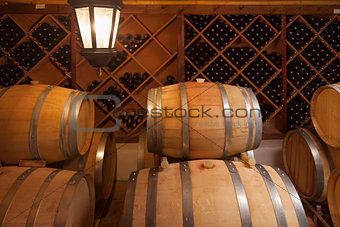 Wine Barrels and Bottles in Cellar