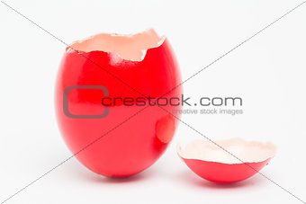 Red painted egg with its top broken off