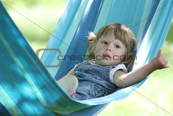 little girl on a hammock,