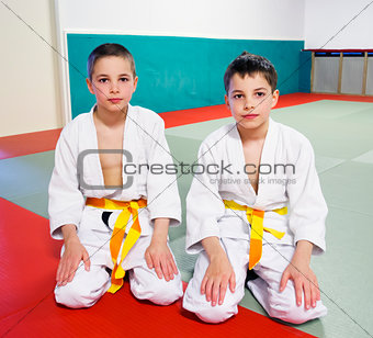 boys in sports hall is engaged in judo