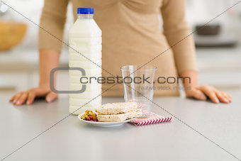 Closeup on breakfast of young woman in kitchen