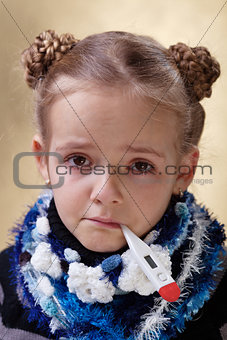 Little girl with red eyes having the flu