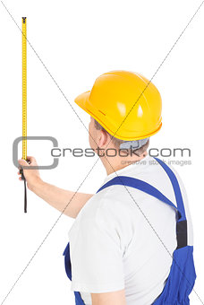 worker with measuring tape, vertical