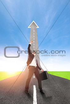 success businessman with the road rising up background