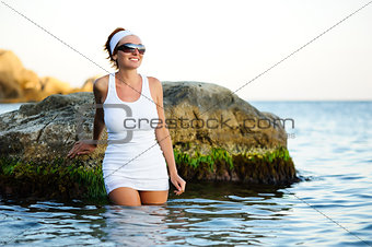 Beautiful woman splashing in the sea