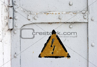 electrical hazard symbol on iron door