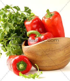 Fresh ripe red bell paprika peppers and parsley