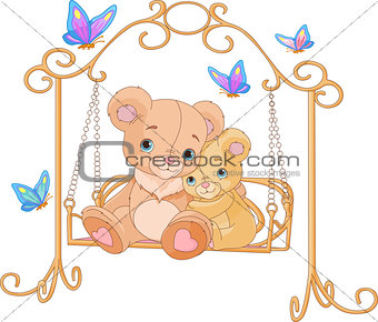 Pair of bears on a swing