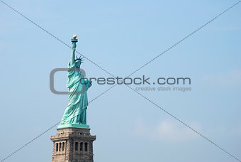 The Statue of Liberty against a blue sky