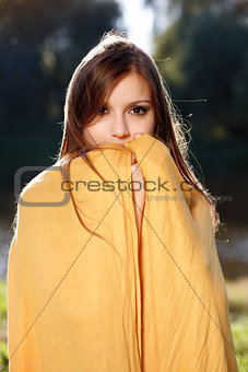 young beautiful woman hiding her face