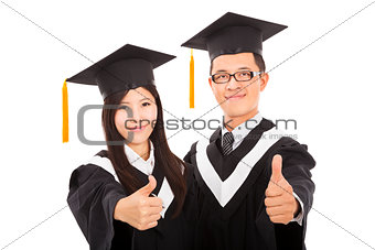  happy couple graduate students with thumbs up isolated on white