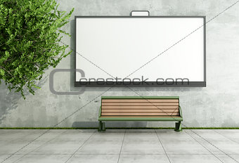 Advertising street bilboard on grunge wall with bench