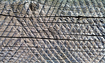  Old wooden board with traces of circular saw.  Background. 