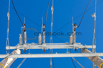 Electricity disconnector,insulators on a blue sky background