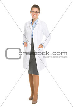 Full length portrait of smiling ophthalmologist doctor woman in 