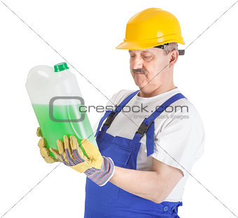 manual worker with green liquid over white