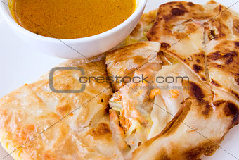 Indian Roti Prata with Curry Sauce Closeup
