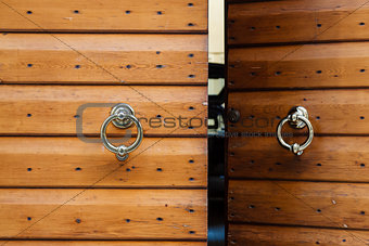 Old Wooden Door with Metal Knockers in Verona, Veneto, Italy
