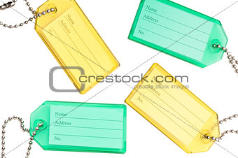 Yellow identity tag with a chain isolated on white 