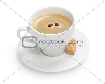 cup of espresso with cane sugar and two beans