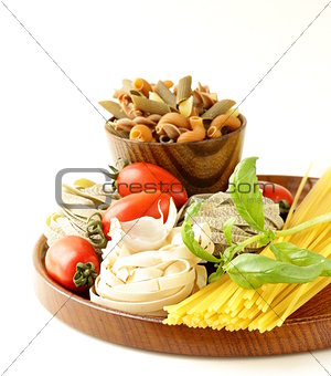 Various types of pasta (spaghetti, fettuccini, penne) and tomato