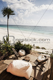 terrace of a cabana on beach with bean bag chair