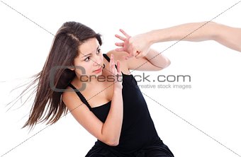 Teenage girl afraid of a hand hitting her