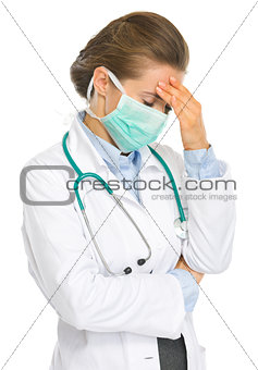 Frustrated medical doctor woman in mask