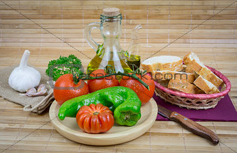 still life with olive oil,vegetables on wood table 