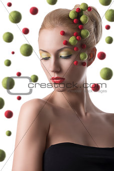 girl with colored spheres on the face
