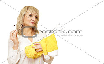 woman with glasses and a yarn