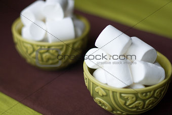 Two national oriental bowls with white marshmallows