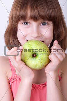 child with a green apple