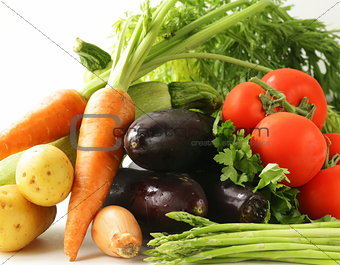 fresh spring vegetables - carrots, tomatoes, asparagus, eggplant and potatoes