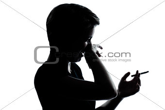 one young teenager boy or girl smoking cigarette disgust silhoue