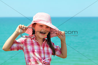 girl in a hat laughing