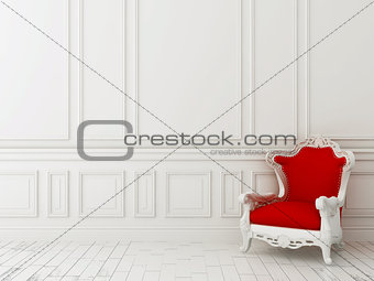Red chair against a white wall