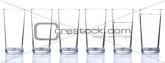 Six glasses with different levels of water