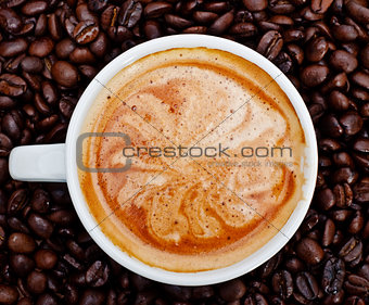 espresso cup in coffee beans