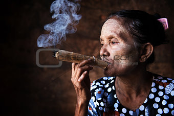 Old Asian woman smoking 