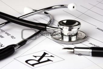 Stethoscope Over A Report