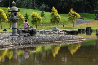 man, yoga and pond in the park